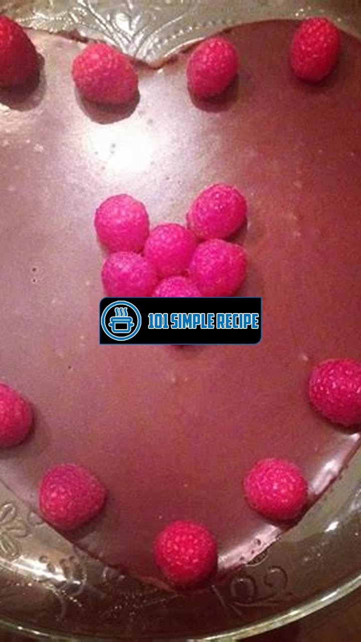 Indulge in Decadence: Flourless Chocolate Cake with Ganache and Raspberries | 101 Simple Recipe